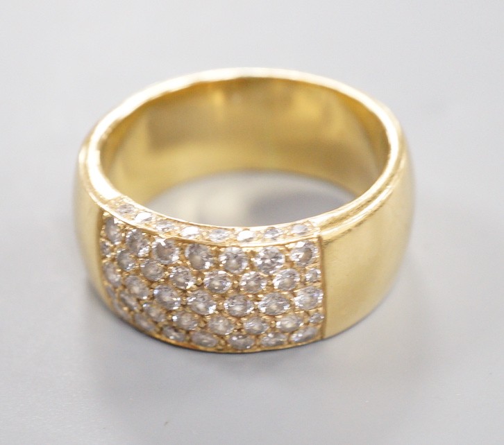 A modern yellow metal (tests as 18ct) and part pave set diamond ring, size R/S gross weight 13.4 grams.